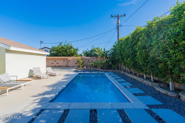 a view of a swimming pool with a patio