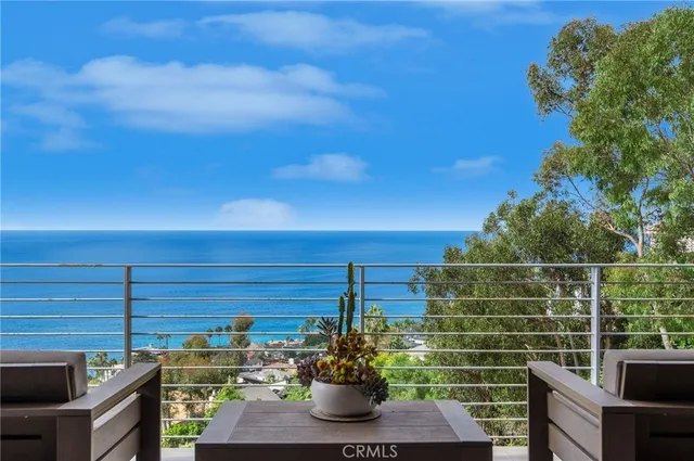 a bedroom with a large bed and a flat screen tv
