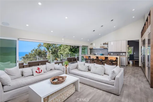 a kitchen with stainless steel appliances granite countertop a sink and a refrigerator