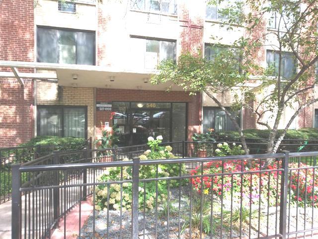 540 West Roscoe Street, Unit 382 Chicago, IL 60657 - Photo 1 of 13 a view of a house with a yard