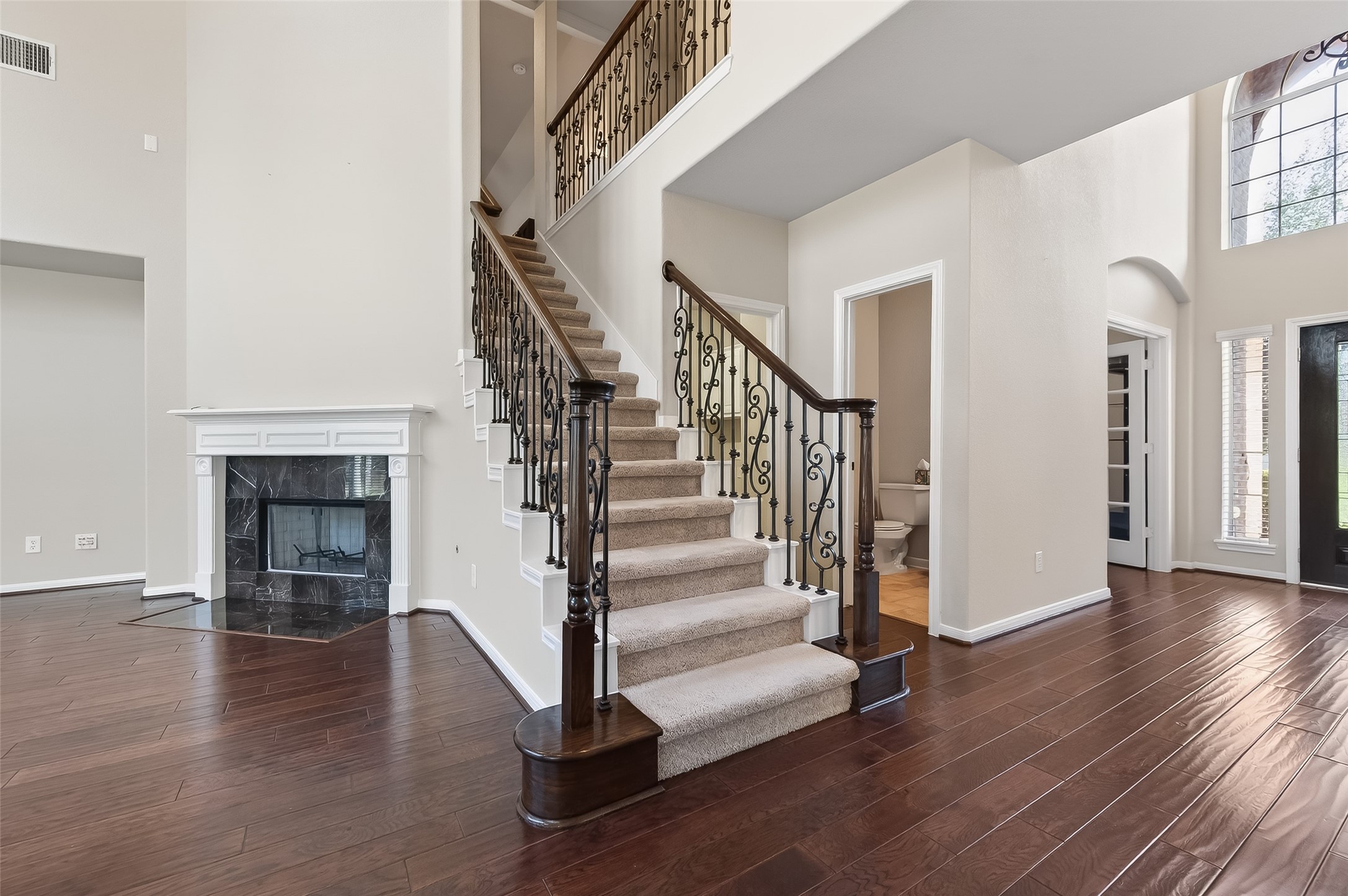 22 North Arrow Canyon Circle Spring, TX 77389 - Photo 18 of 50 a view of entryway with wooden floor and stairs