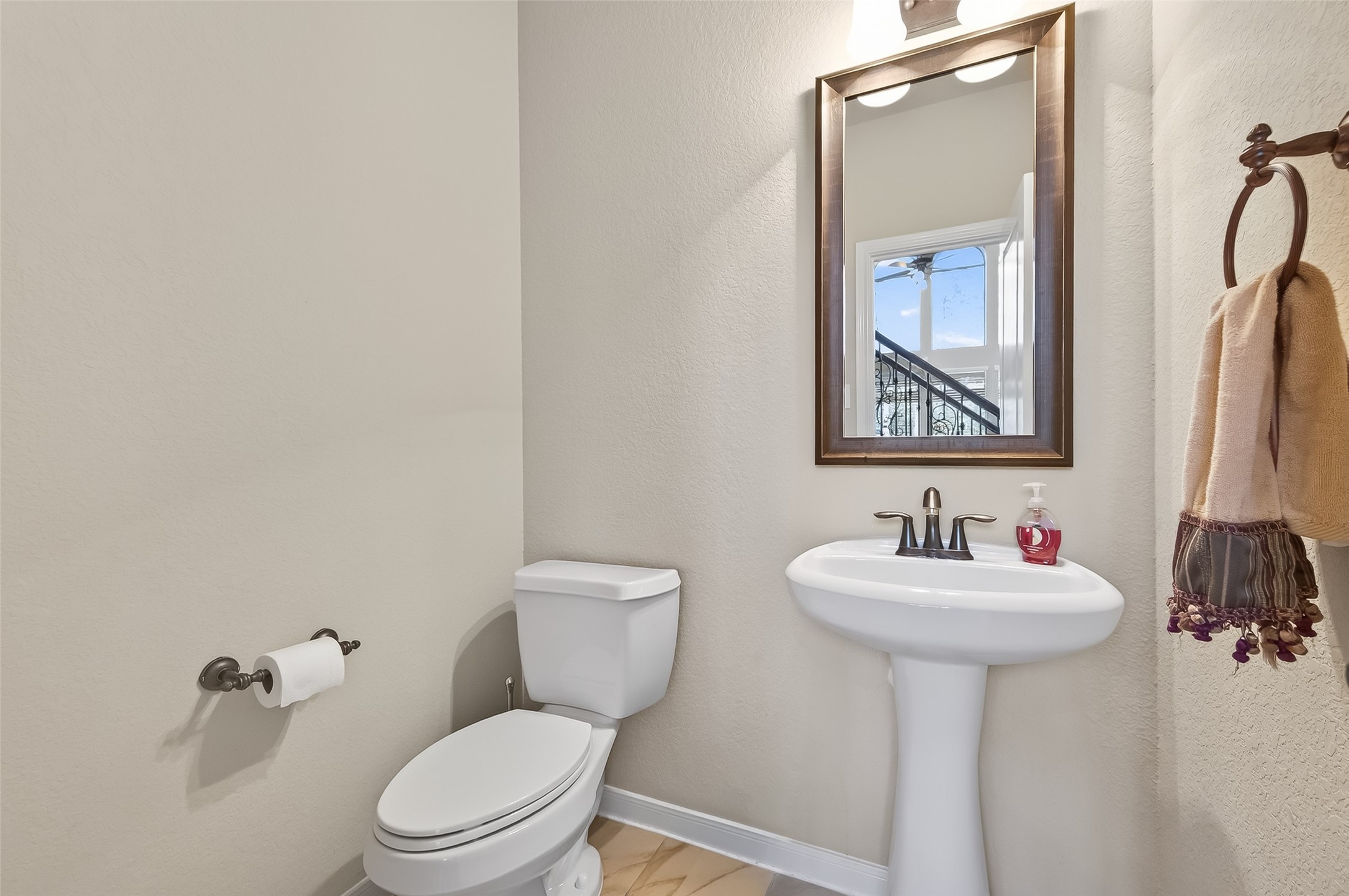 22 North Arrow Canyon Circle Spring, TX 77389 - Photo 20 of 50 a bathroom with a toilet sink and mirror