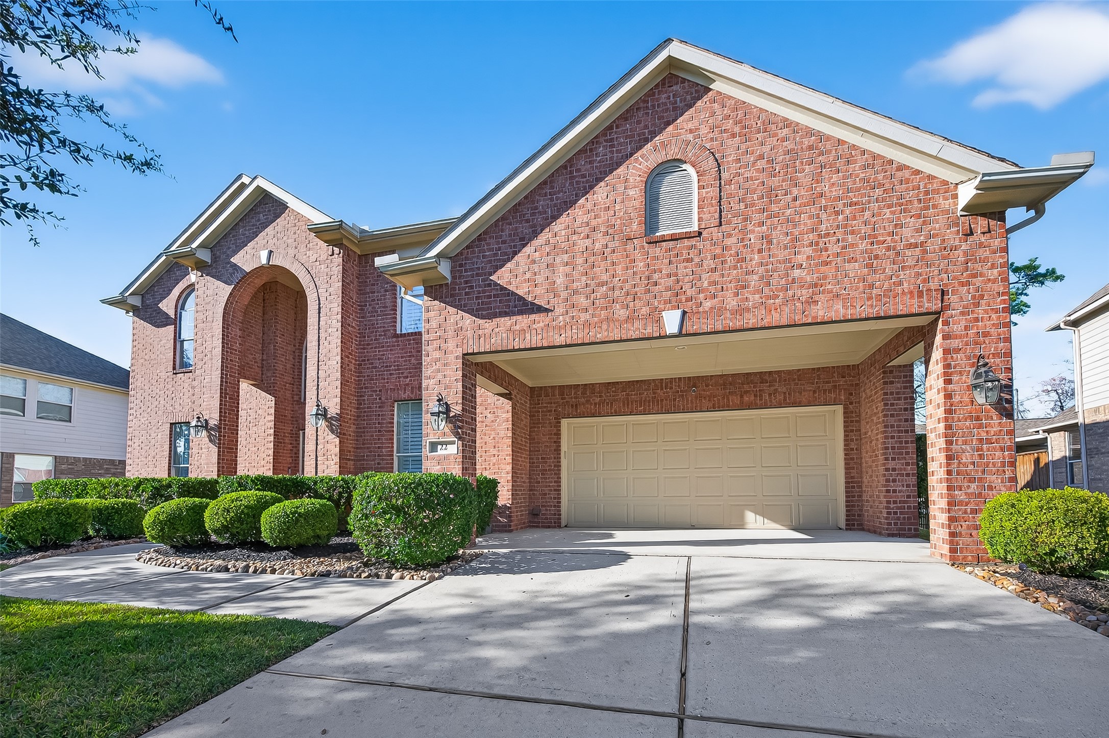 22 North Arrow Canyon Circle Spring, TX 77389 - Photo 3 of 50 a front view of a house with a yard and garage