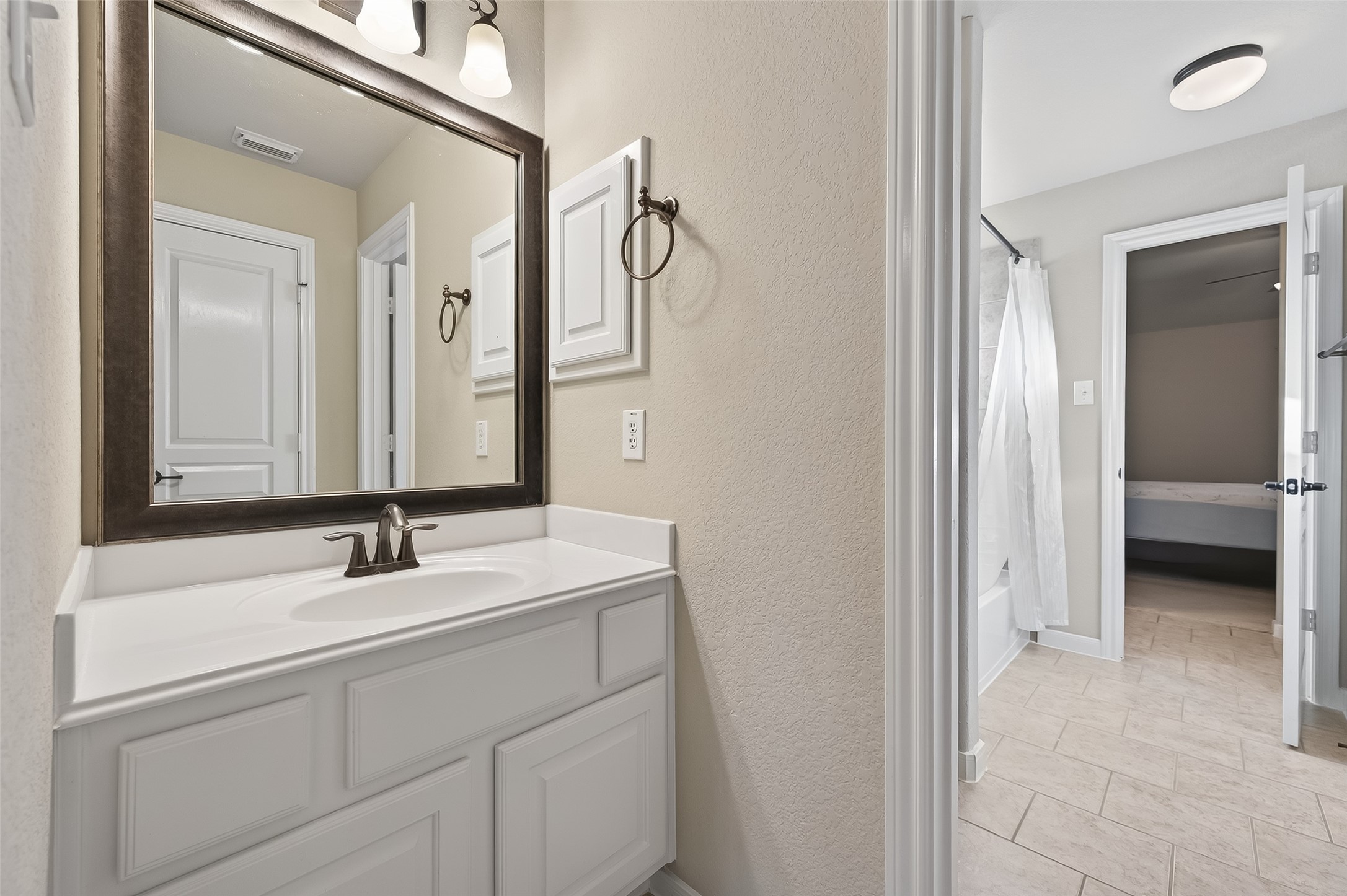 22 North Arrow Canyon Circle Spring, TX 77389 - Photo 32 of 50 a bathroom with a sink and a mirror