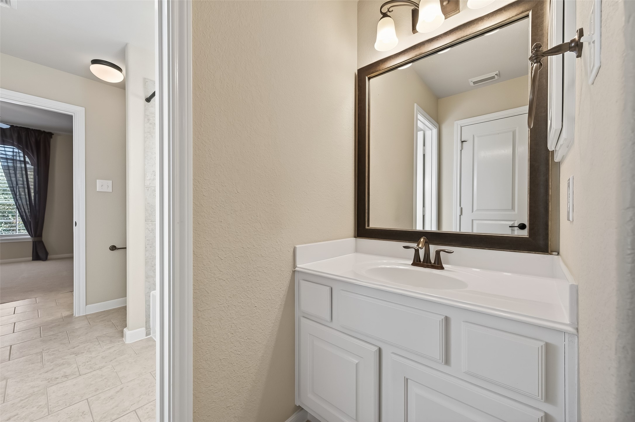 22 North Arrow Canyon Circle Spring, TX 77389 - Photo 34 of 50 a bathroom with a sink and a mirror