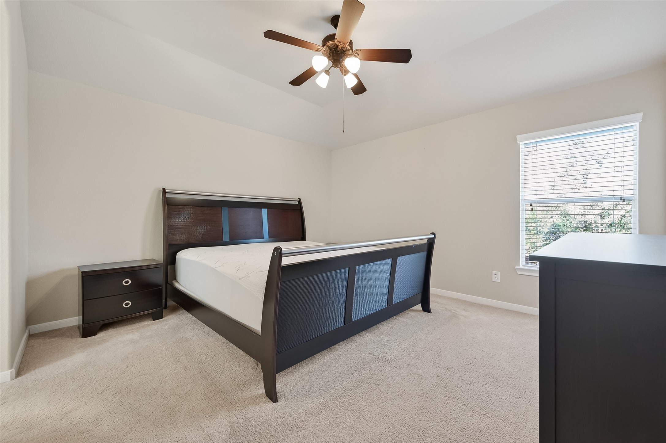 22 North Arrow Canyon Circle Spring, TX 77389 - Photo 35 of 50 a bedroom with a bed and a ceiling fan