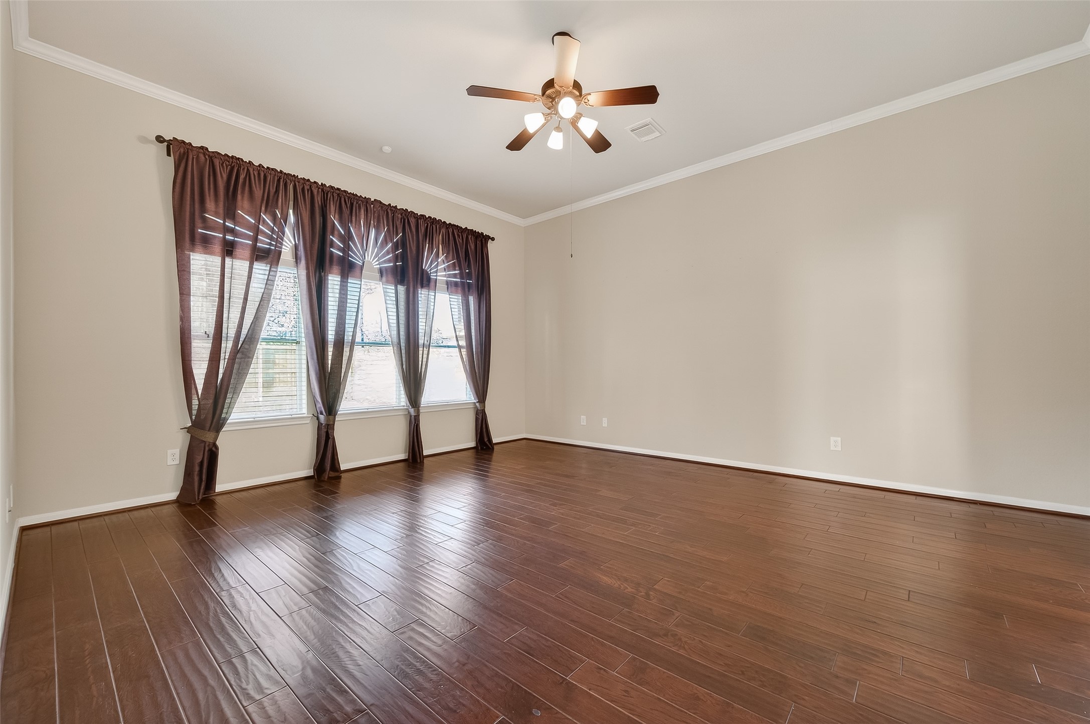 22 North Arrow Canyon Circle Spring, TX 77389 - Photo 36 of 50 a view of an empty room with wooden floor and a window