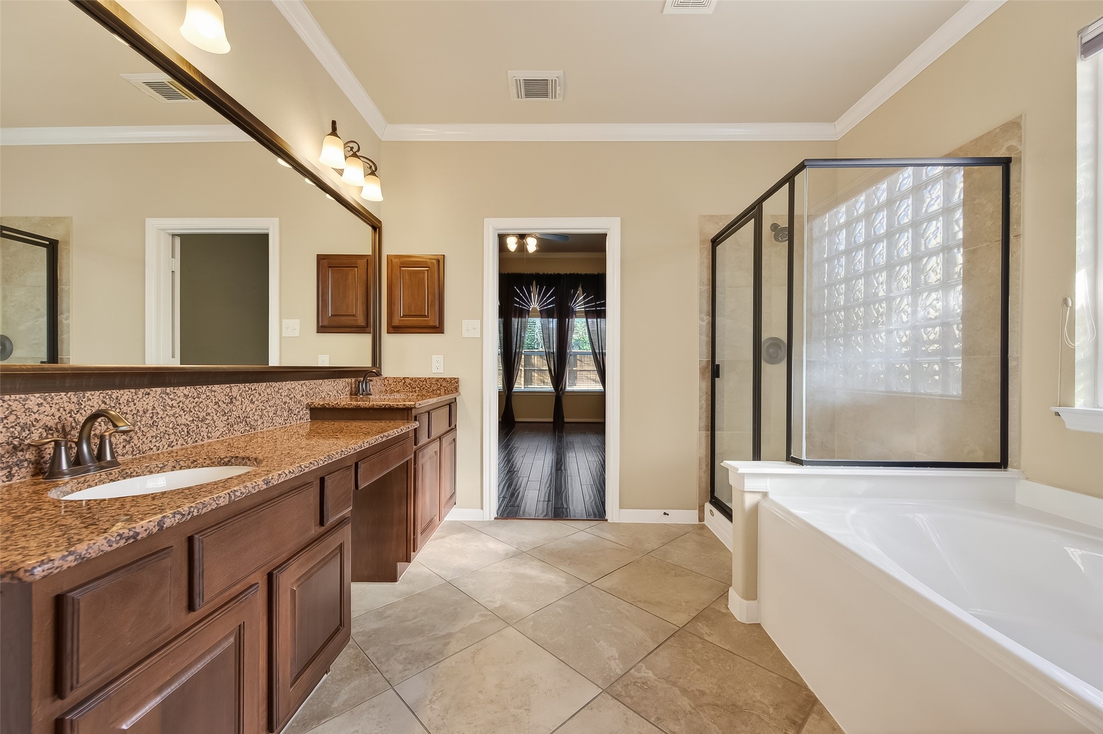 22 North Arrow Canyon Circle Spring, TX 77389 - Photo 42 of 50 a spacious bathroom with a granite countertop tub sink and mirror