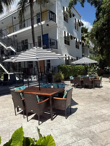 a view of a building with sitting area