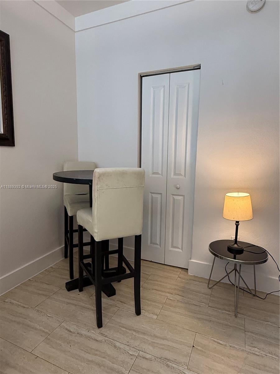 1330 Pennsylvania Avenue, Unit 206 Miami Beach, FL 33139 - Photo 9 of 14 a lamp on a table in a room