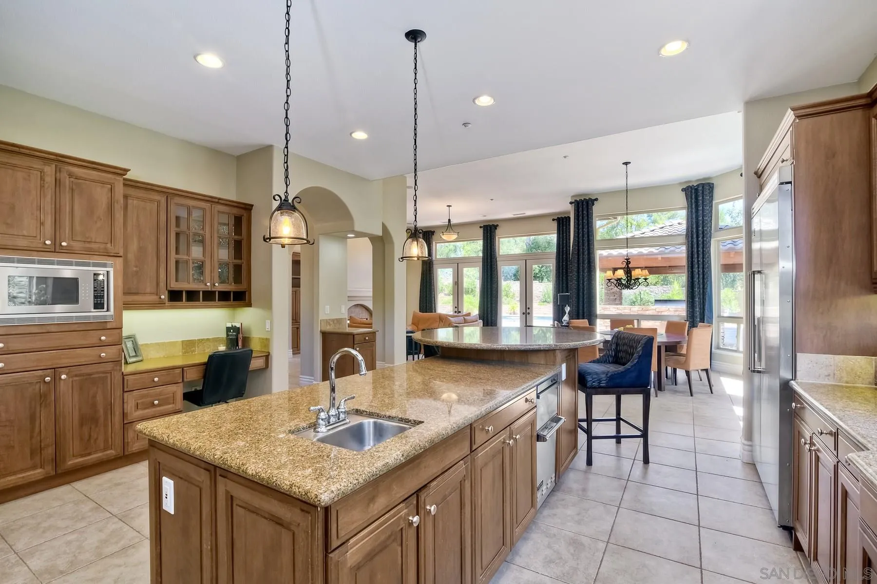 14050 Lake Poway Road Poway, CA 92064 - Photo 12 of 29 a kitchen with counter top space appliances and windows