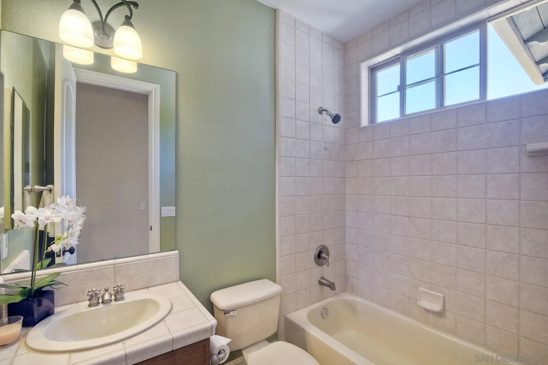 14050 Lake Poway Road Poway, CA 92064 - Photo 14 of 29 a bathroom with a sink toilet and shower