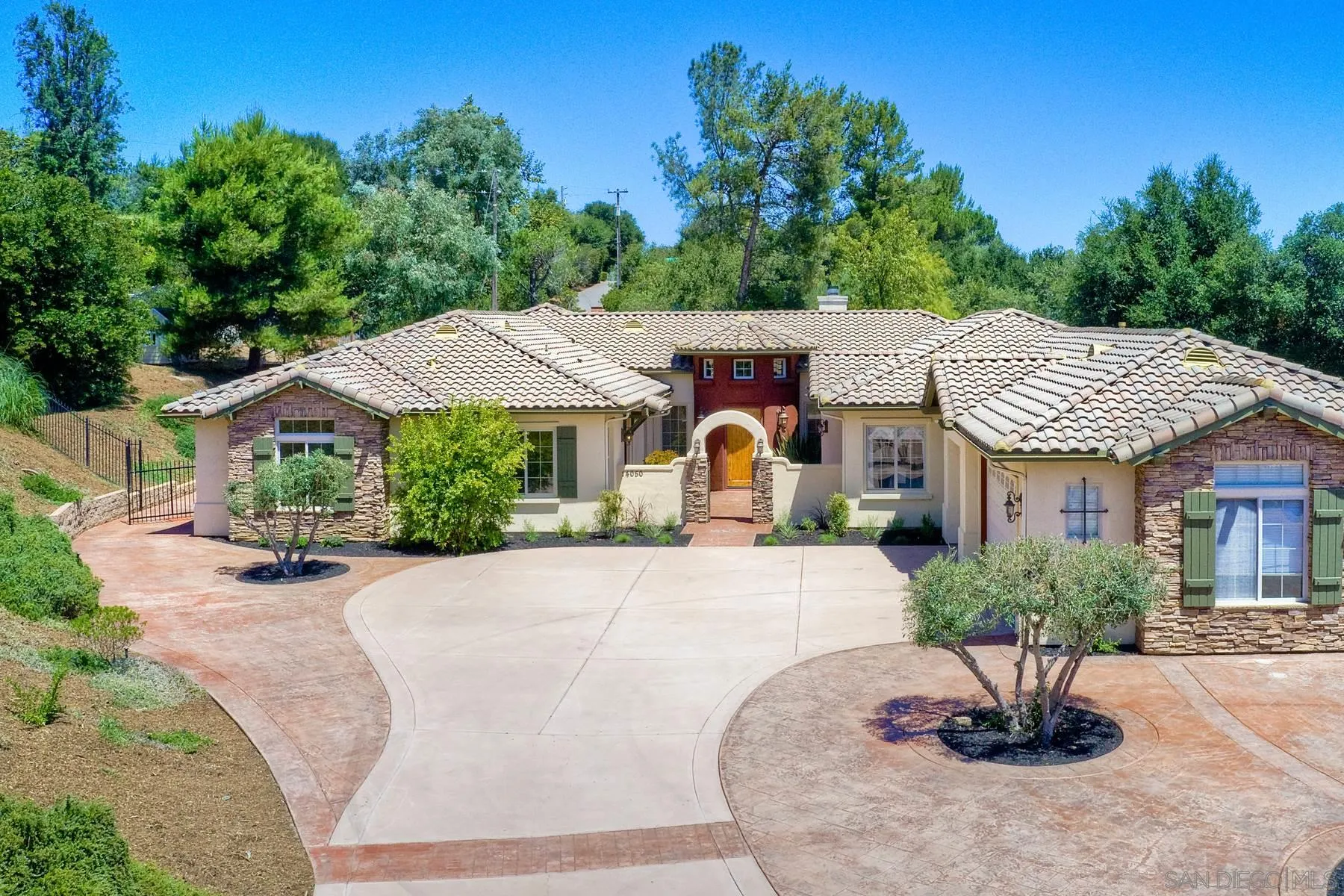 14050 Lake Poway Road Poway, CA 92064 - Photo 2 of 29 a front view of a house with garden