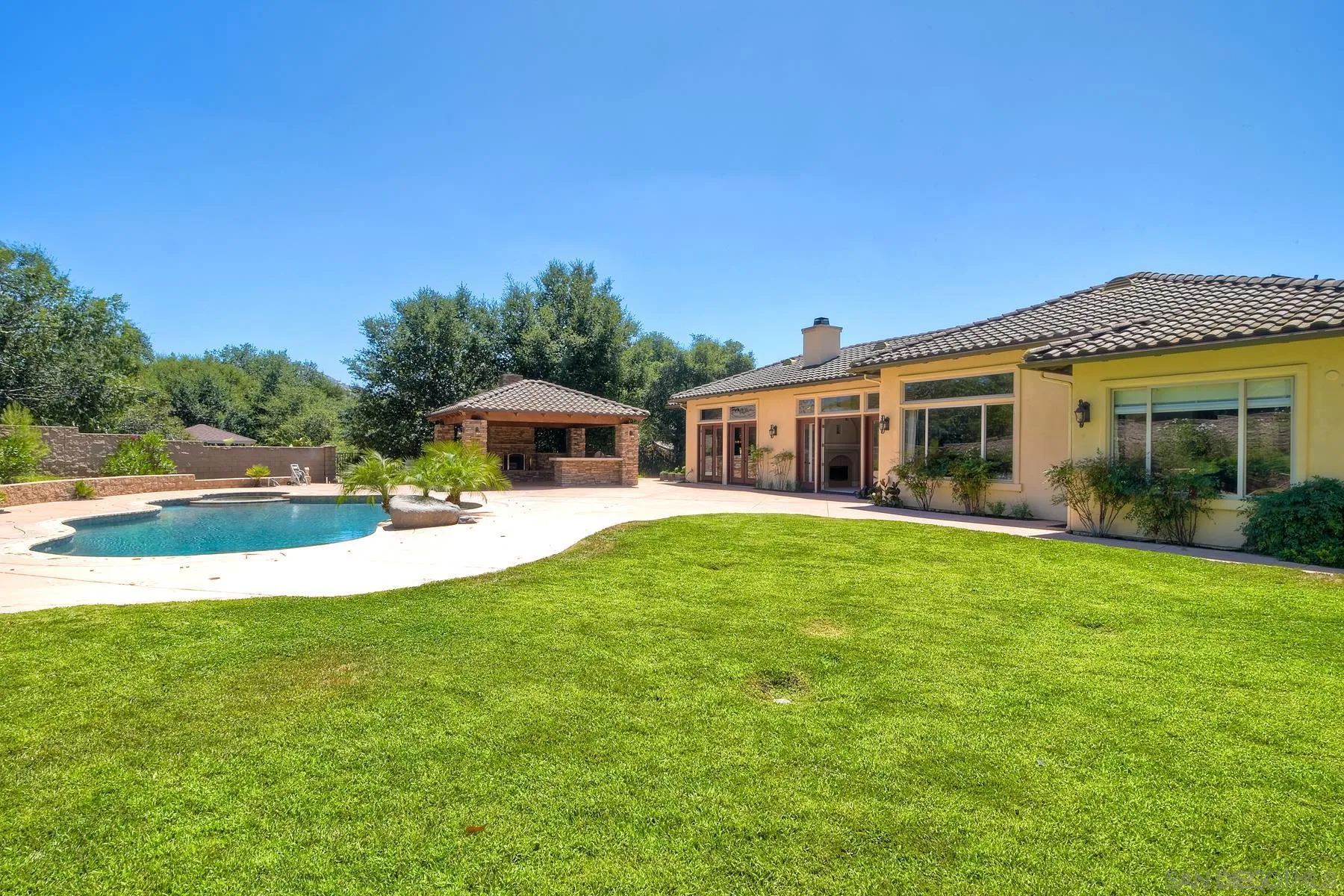 14050 Lake Poway Road Poway, CA 92064 - Photo 23 of 29 a front view of house with yard and seating area