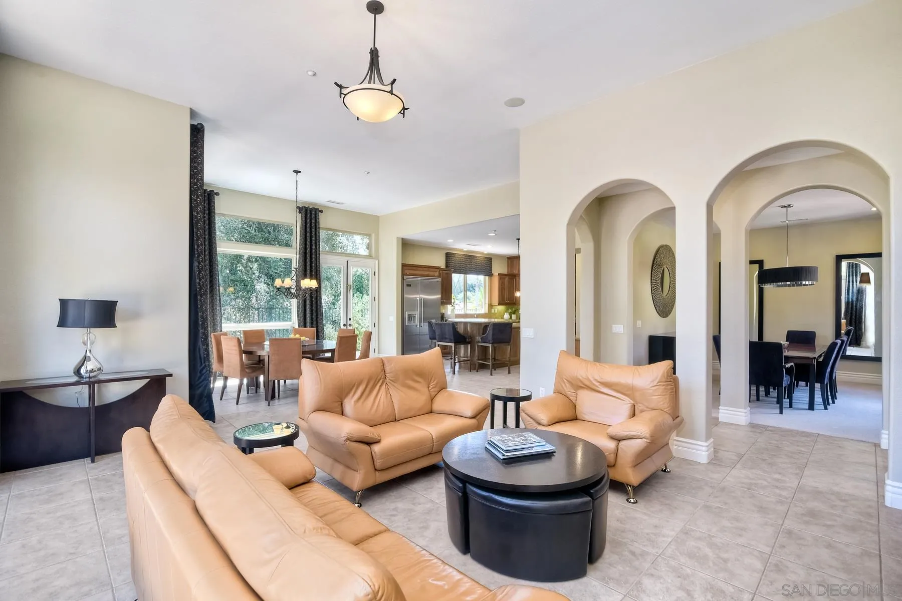 14050 Lake Poway Road Poway, CA 92064 - Photo 8 of 29 a living room with furniture a chandelier and a large window