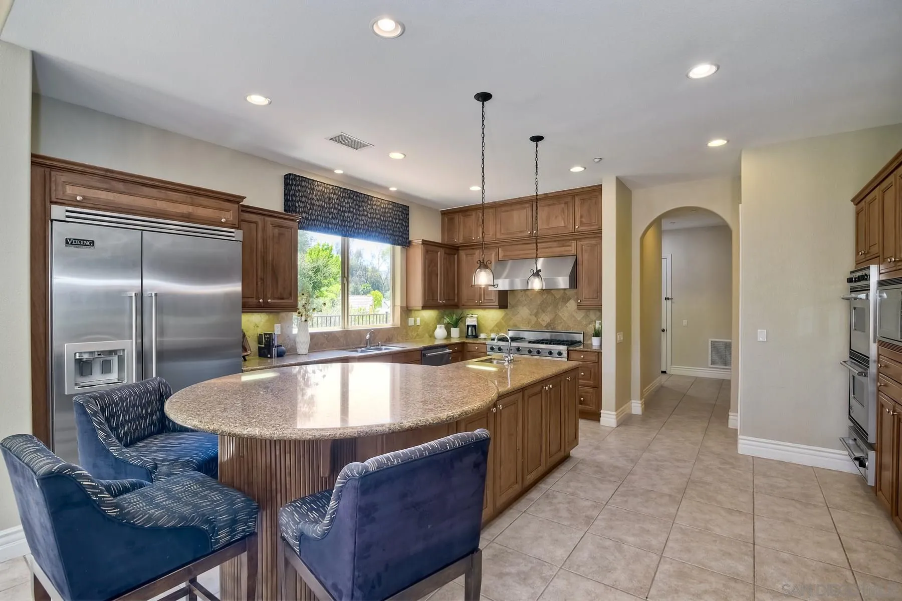 14050 Lake Poway Road Poway, CA 92064 - Photo 10 of 29 a large kitchen with stainless steel appliances granite countertop a sink a stove and a refrigerator