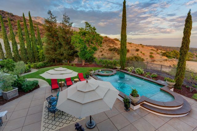 a view of a porch with furniture and plants