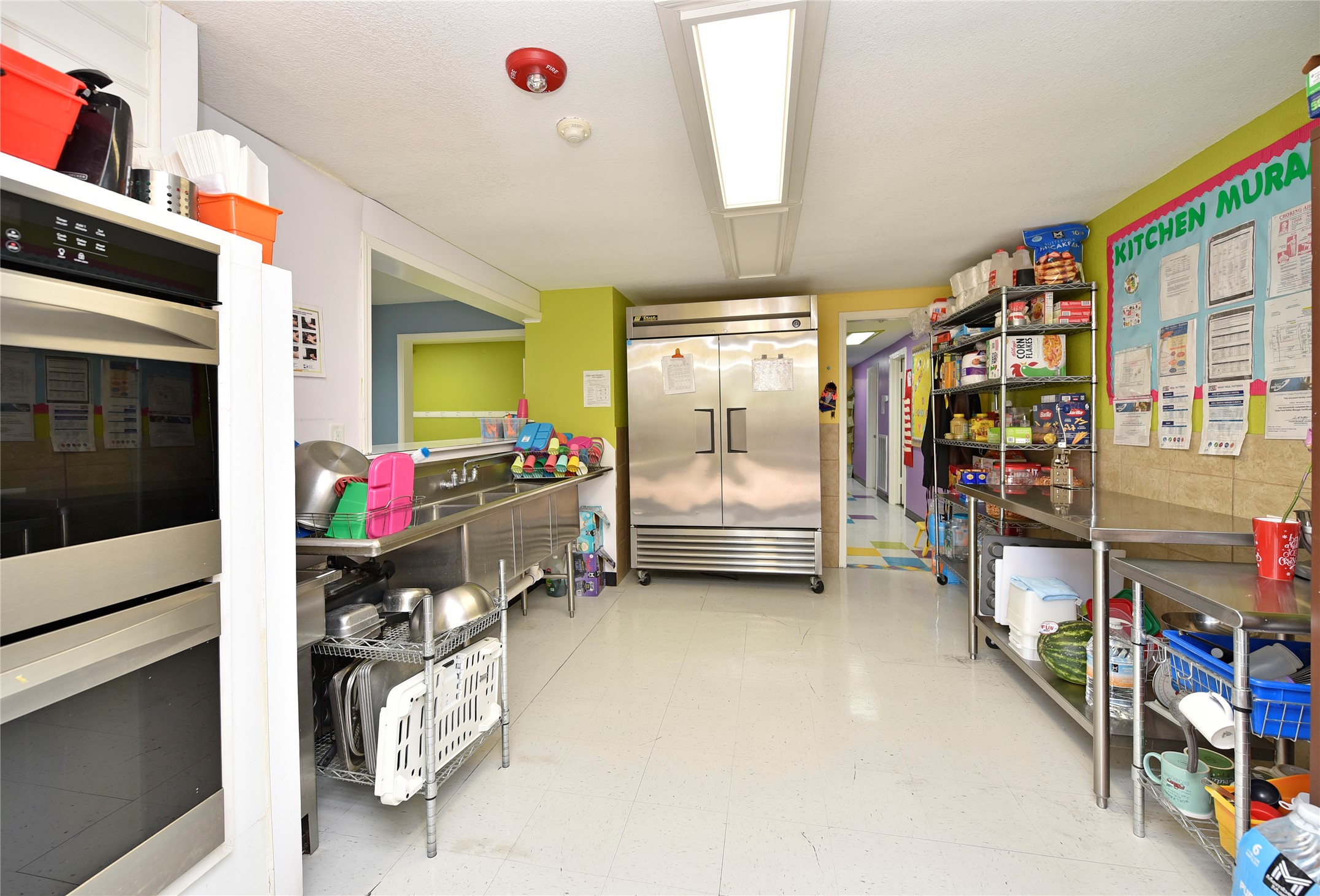1220 Mulcahy Street Rosenberg, TX 77471 - Photo 23 of 41 a bedroom with furniture a flat tv screen and a book shelf