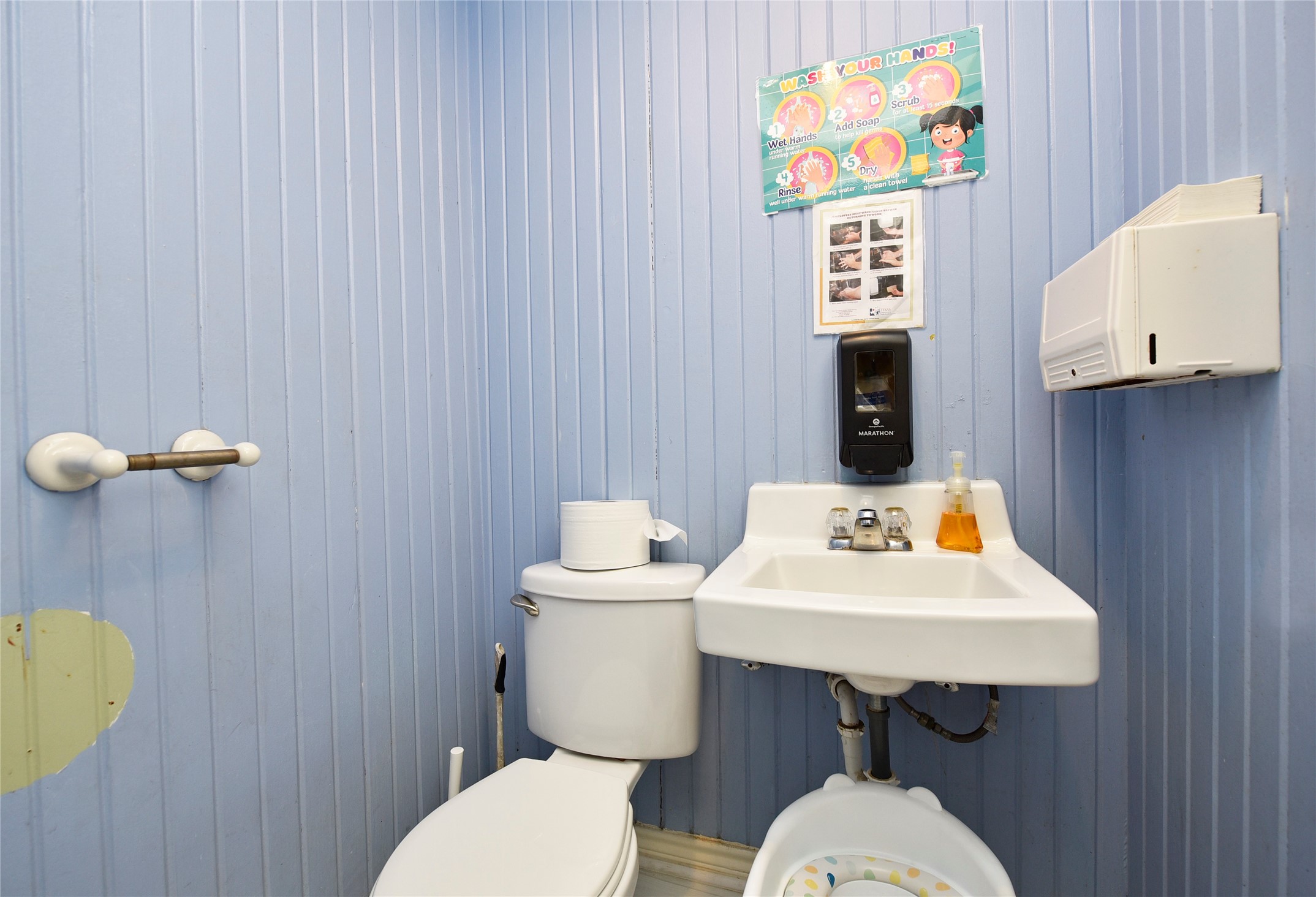 1220 Mulcahy Street Rosenberg, TX 77471 - Photo 31 of 41 a bathroom with a sink a toilet and mirror