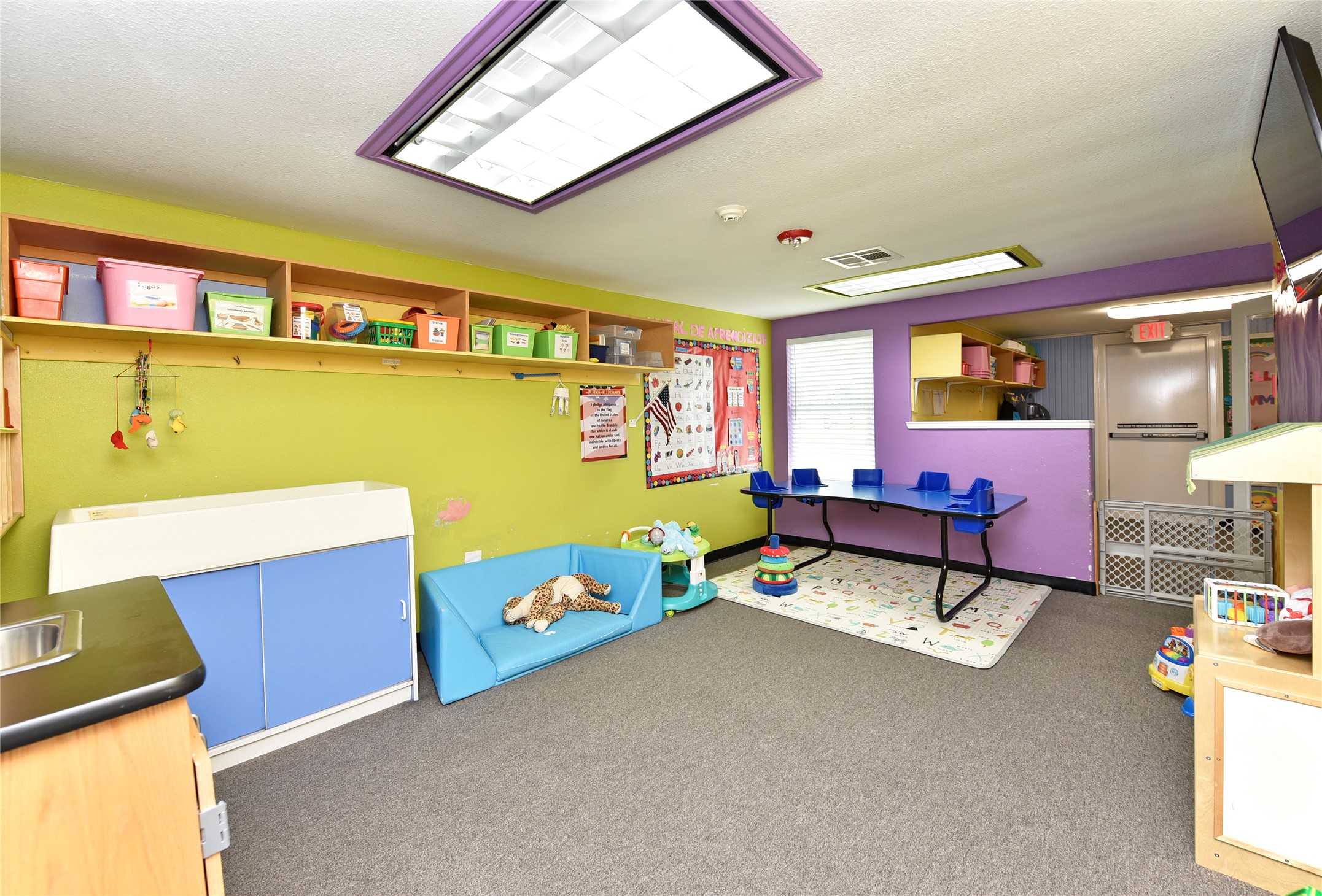 1220 Mulcahy Street Rosenberg, TX 77471 - Photo 35 of 41 a living room with furniture and paintings on the wall