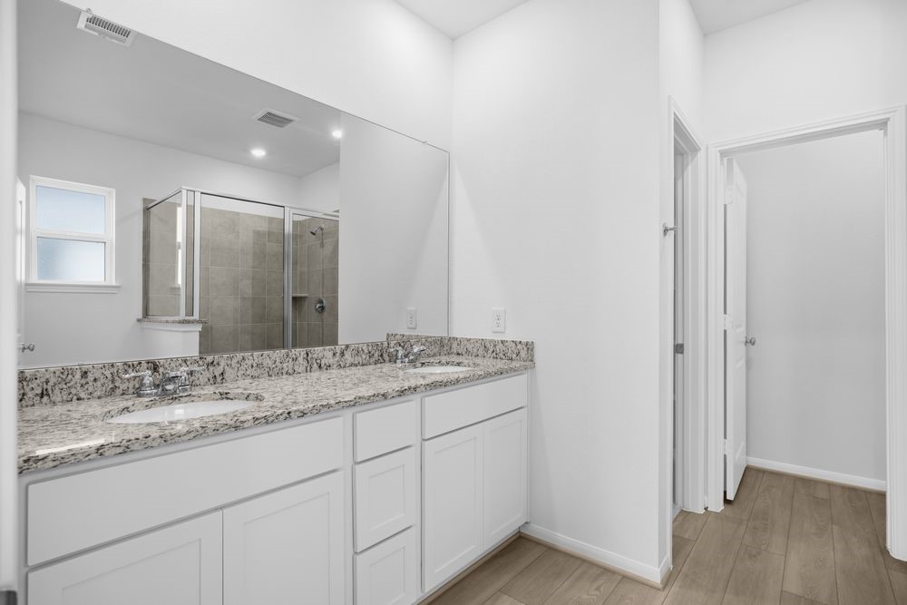 735 Willow Grove Lane Rosenberg, TX 77471 - Photo 12 of 26 a bathroom with a granite countertop sink and a mirror