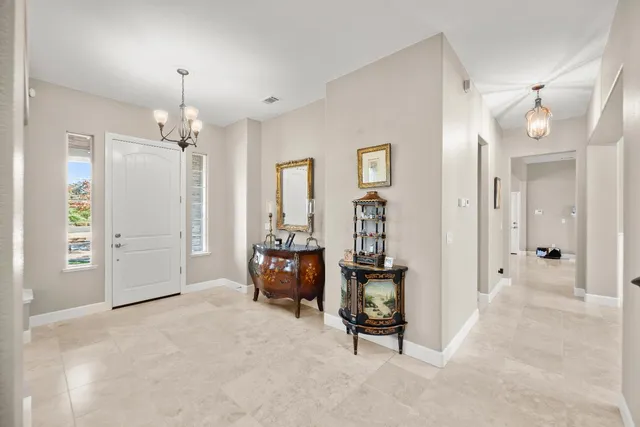 a view of a dining room with furniture and window