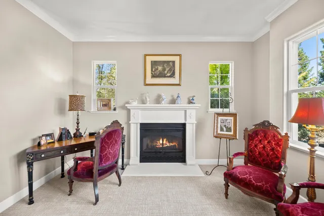 a view of a dining room with furniture and chandelier