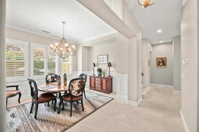 a kitchen with granite countertop stainless steel appliances a sink stove and cabinets