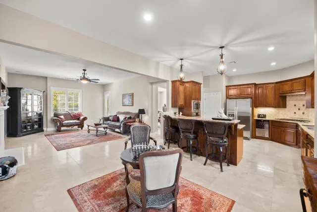a view of a livingroom with workspace and a window