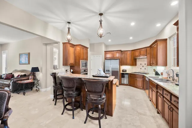 a view of a livingroom with workspace and a window