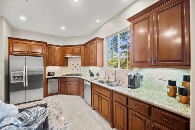 a large white room with a large window and furniture