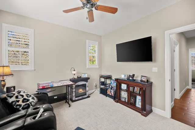 a view of a patio with table and chairs under an umbrella