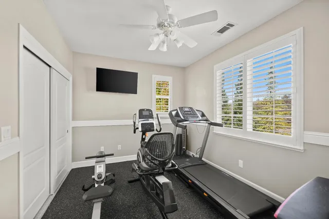 a view of a house with swimming pool and sitting area