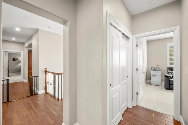 a view of a white house with a yard