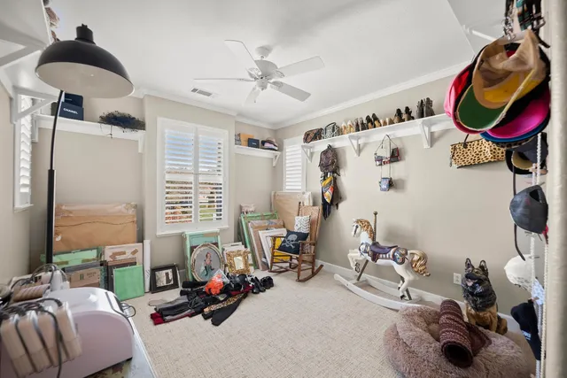 a view of a chair and table in backyard of the house