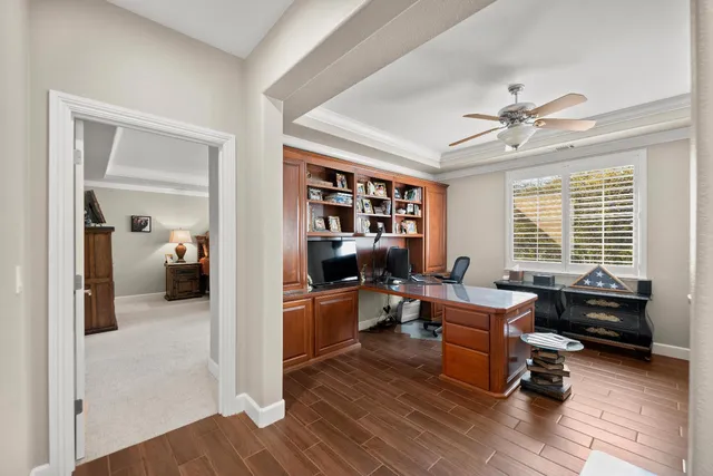 a view of a yard with trees in front of it