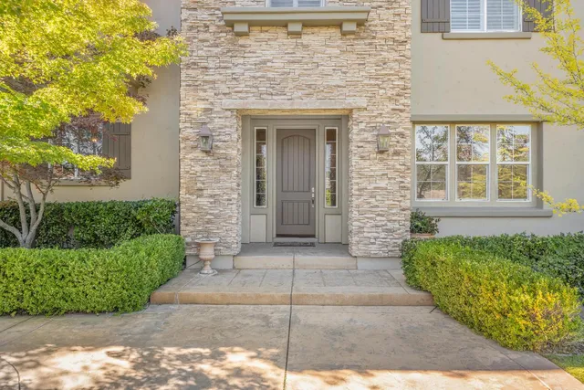 a view of a livingroom with workspace and a window