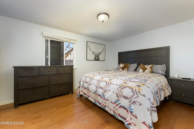 a bedroom with a bed and a dresser