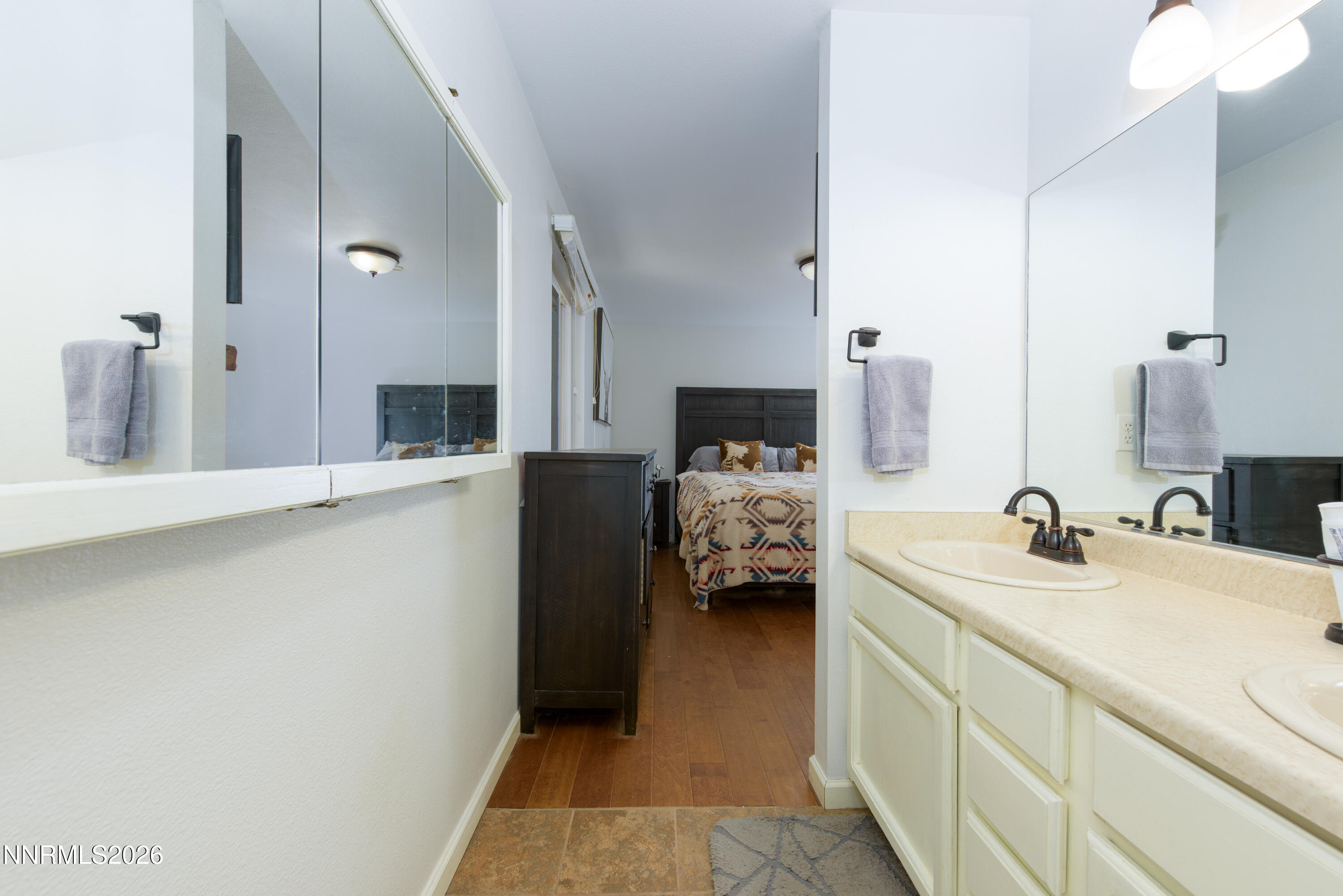 624 Victoria Way Gardnerville, NV 89460 - Photo 12 of 25 a en suite bathroom with a sink and mirror