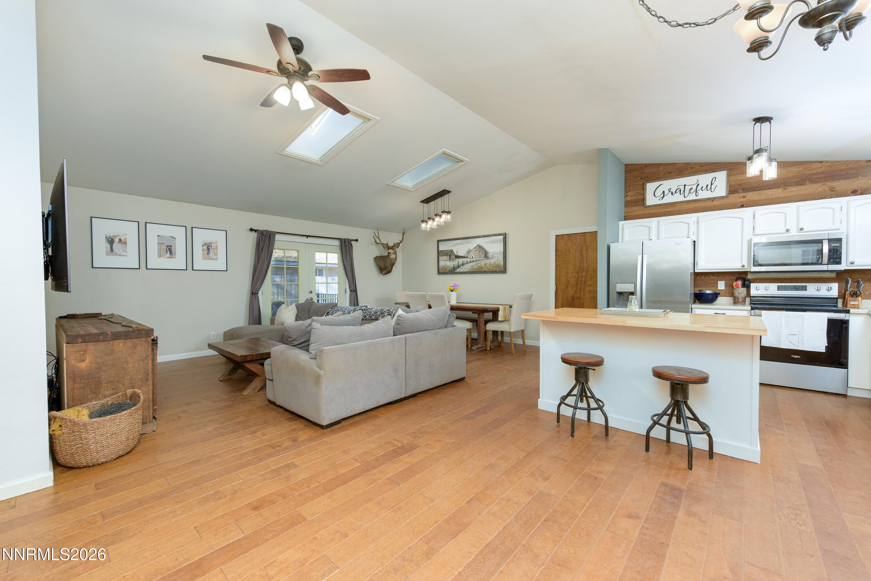 624 Victoria Way Gardnerville, NV 89460 - Photo 3 of 25 a living room with furniture and a chandelier