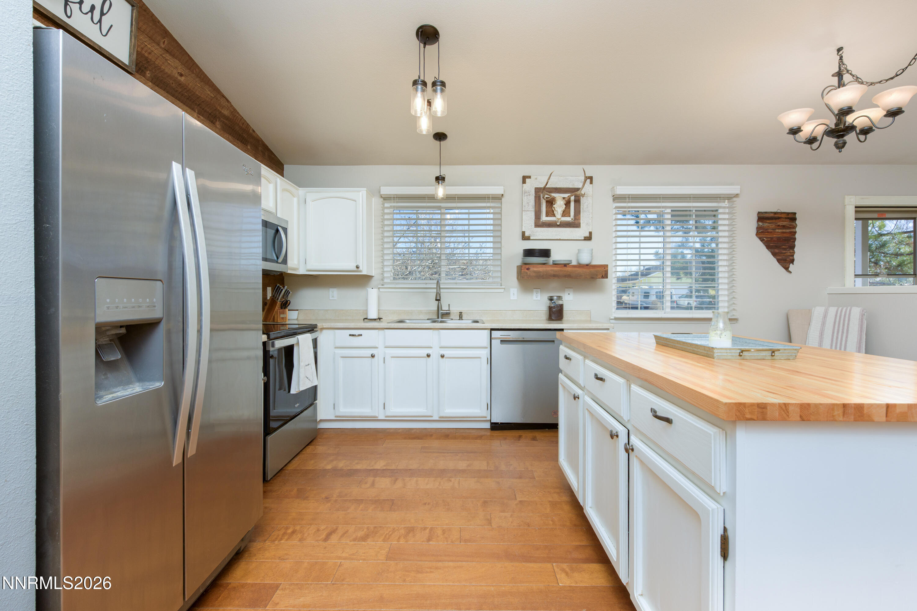 624 Victoria Way Gardnerville, NV 89460 - Photo 5 of 25 a kitchen with a sink refrigerator and cabinets