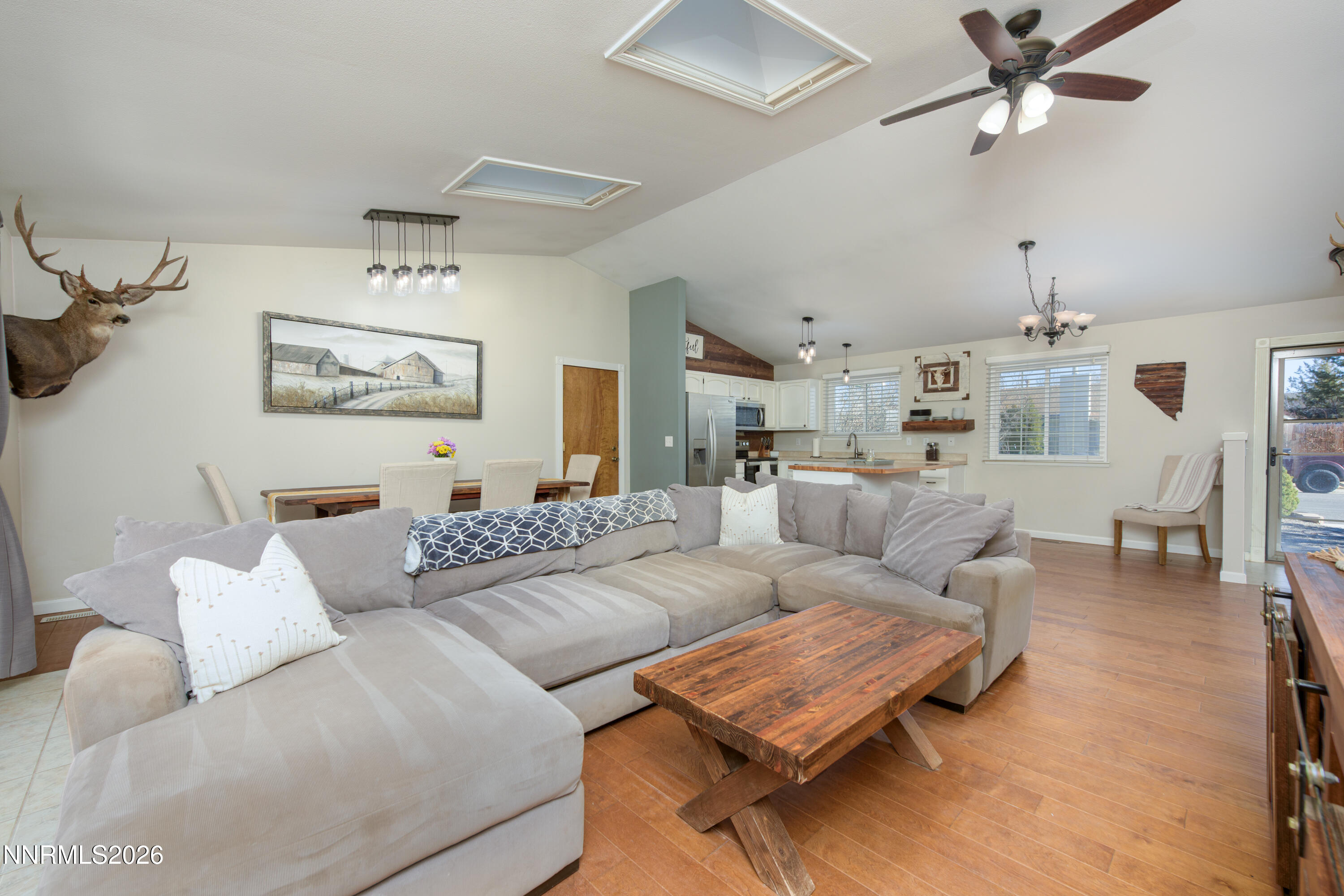 624 Victoria Way Gardnerville, NV 89460 - Photo 10 of 25 a living room with furniture and a chandelier