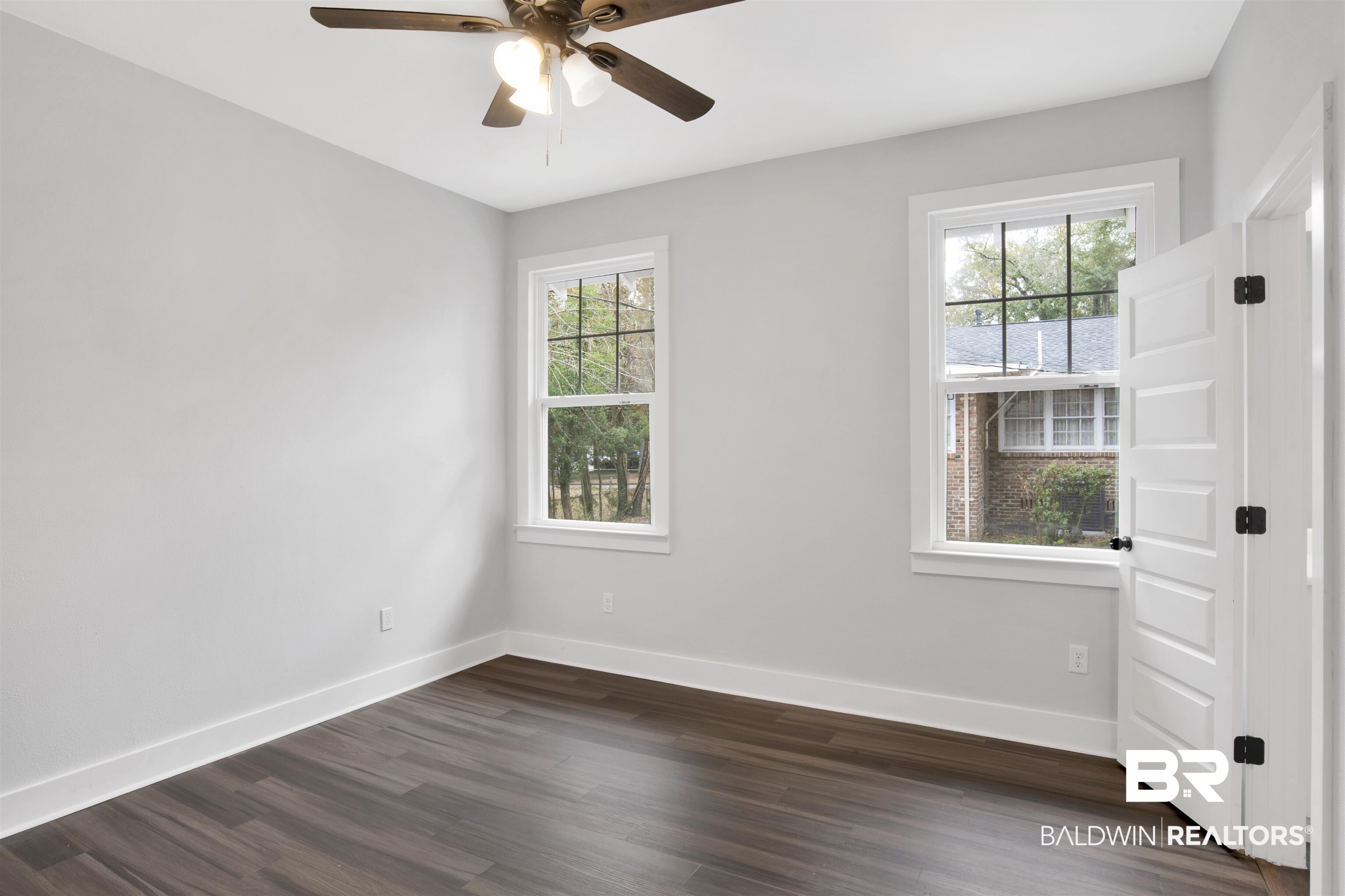 302 1st Street Mobile, AL 36611 - Photo 21 of 28 Spare room featuring dark wood-type flooring and ceiling fan