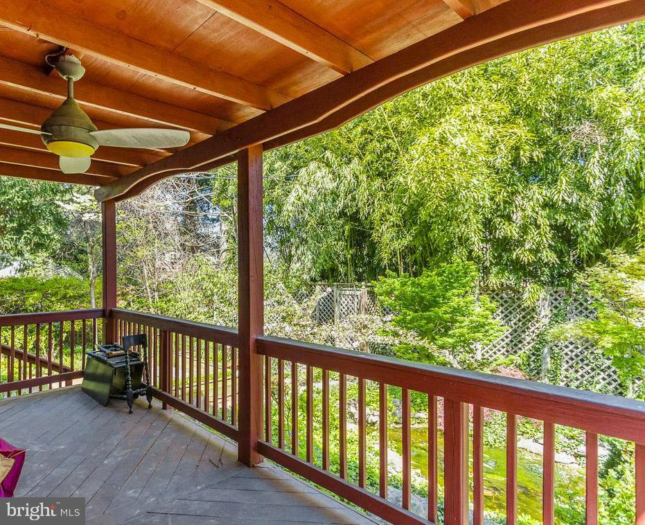 2418 Briarwood Road Baltimore, MD 21209 - Photo 40 of 55 a view of a porch with a table and chairs