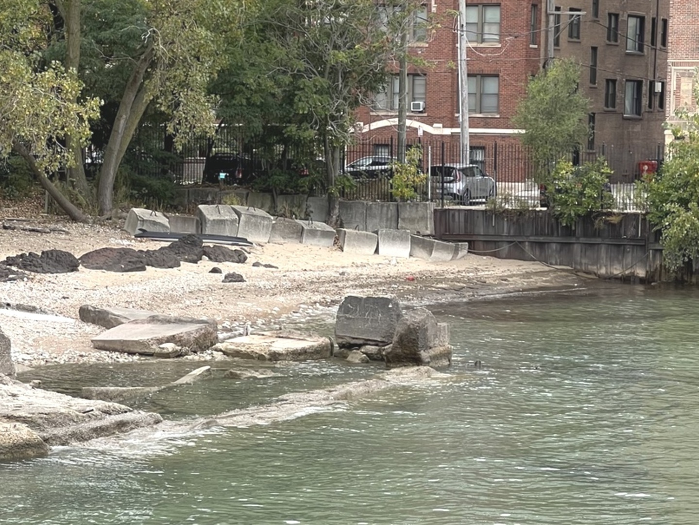 7337 South South Shore Drive, Unit 904 Chicago, IL 60649 - Photo 12 of 15 a swimming pool with some trees in the background