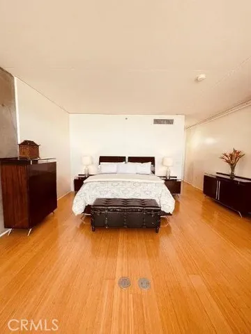 a bedroom with a bed and dresser