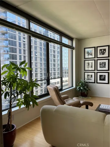 a living room with furniture and flowers