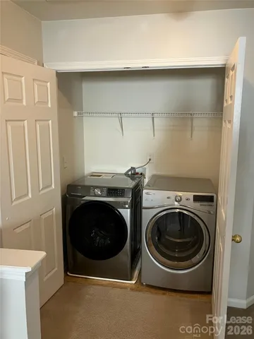 a view of swimming pool with large trees