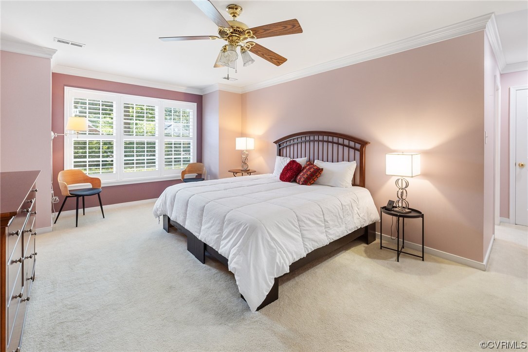 5000 Park Commons Loop Glen Allen, VA 23059 - Photo 17 of 32 a bedroom with a bed a lamp and a large window