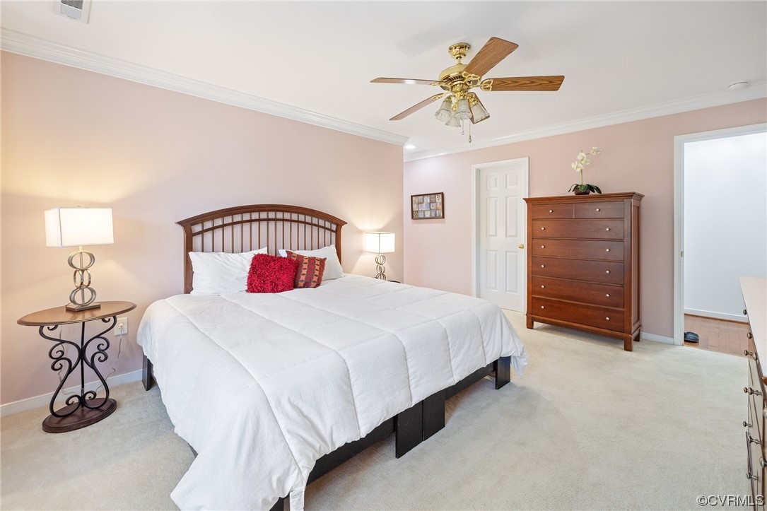 5000 Park Commons Loop Glen Allen, VA 23059 - Photo 21 of 32 a bedroom with a bed and a chandelier